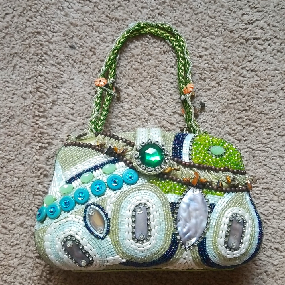 Handmade beaded jeweled bag. Zipper divided pocket. Green lining. Snap closure